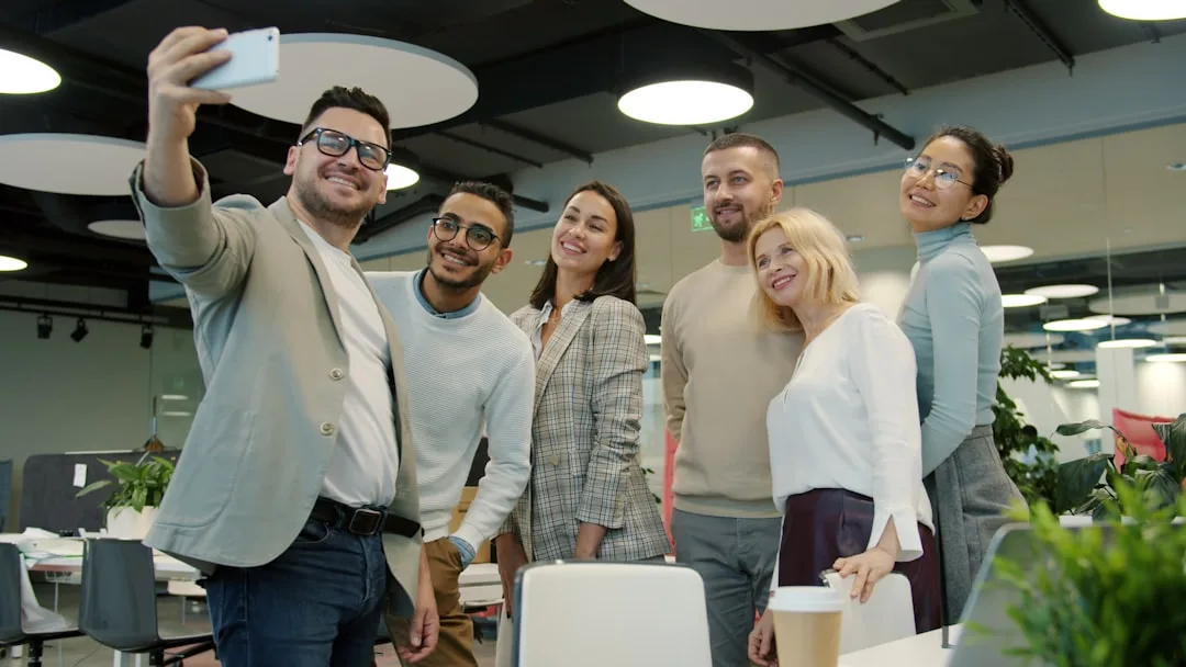 Diverse Kyool tech team collaborating in the office on fitness app development