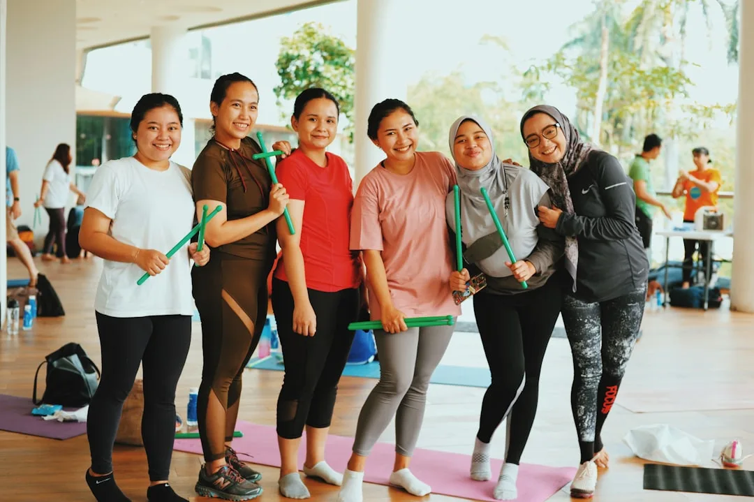 Kyool fitness group celebrating a shared workout achievement together