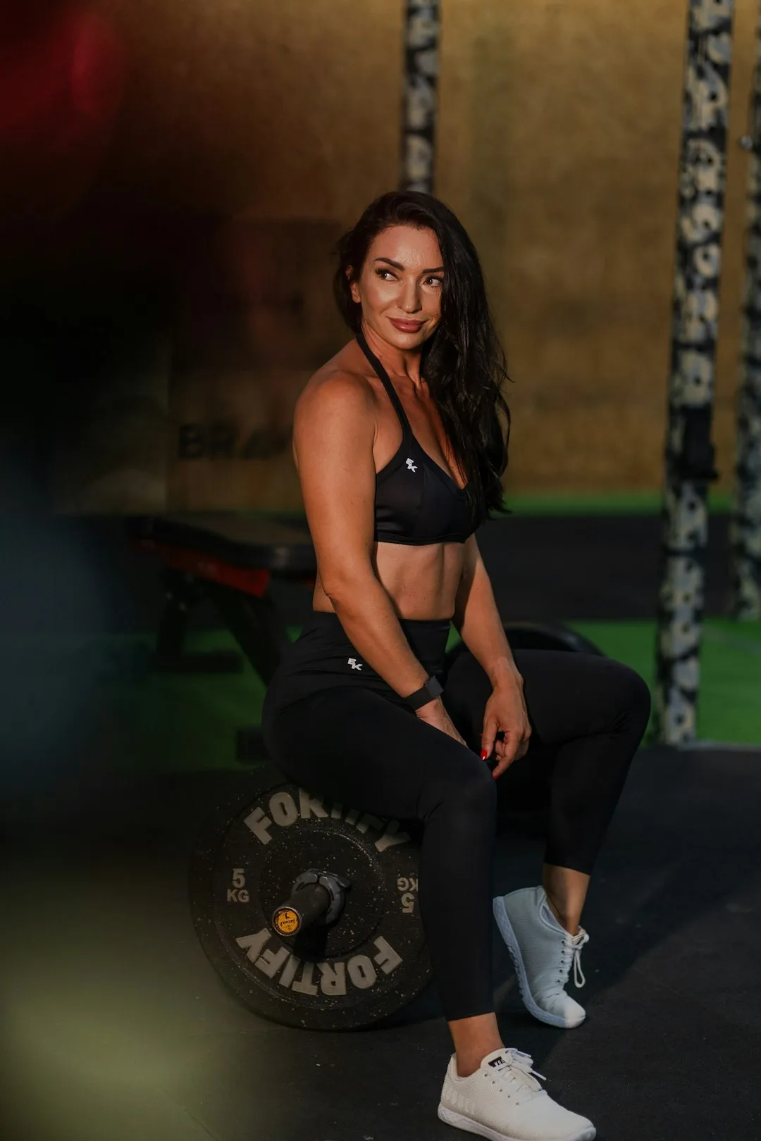 Woman doing strength training workout with Kyool group accountability